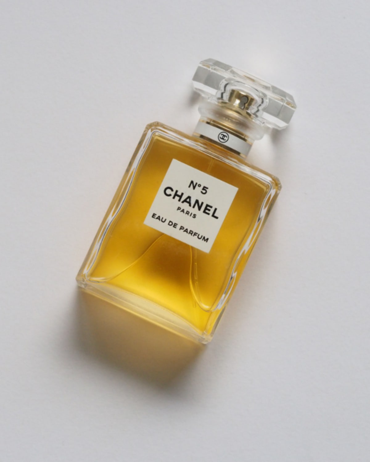 Woman applying a light fragrance before leaving for work