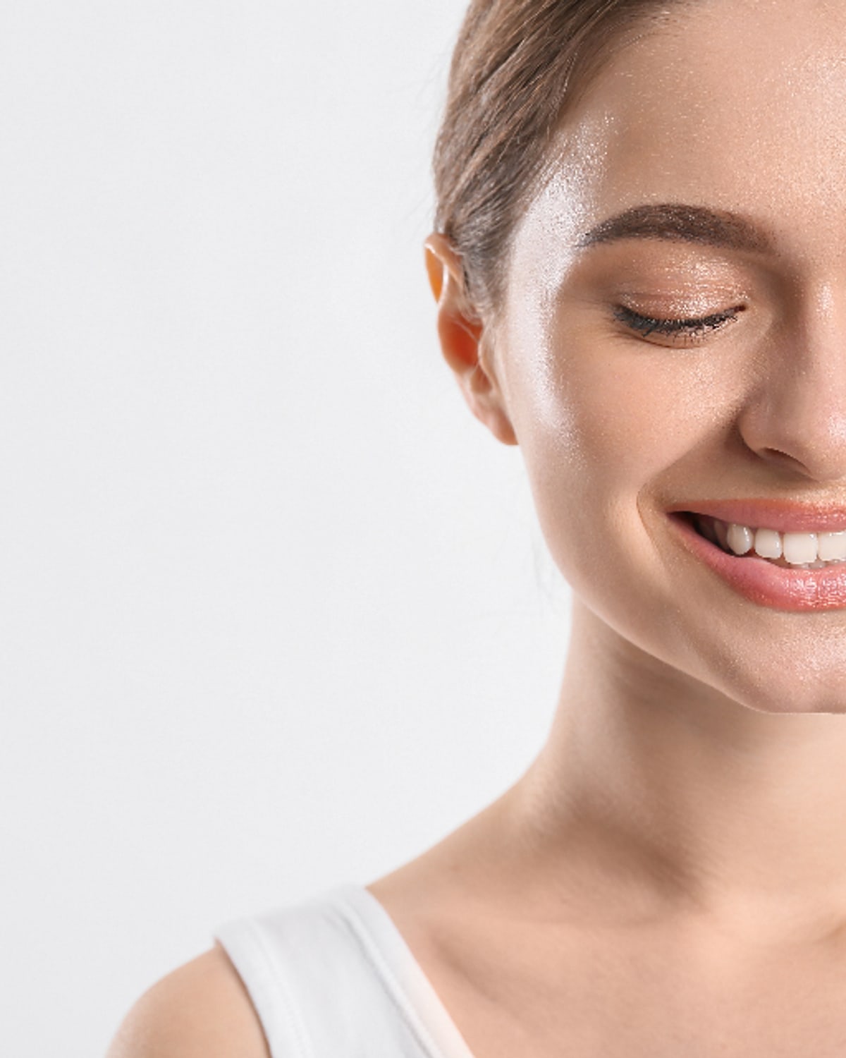 Woman reviewing a gentle retinol product at a bathroom vanity